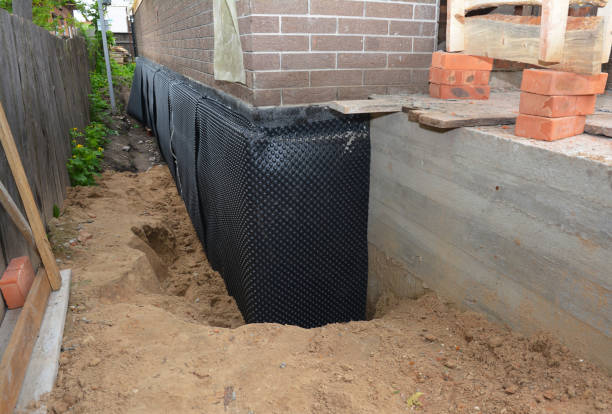 Happy homeowners after waterproofing job in Latham